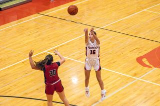 Nathan Ecker/News-Register##Cameron Baker watches a 3-point attempt take flight over Glencoe&rsquo;s Lluvia Zendejas during the Grizzlies easy surfing over the Crimson Tide on Tuesday, Jan. 27, in the MHS gymnasium. Mac extended its win streak over Glencoe to six dating back to Feb. 7, 2023.