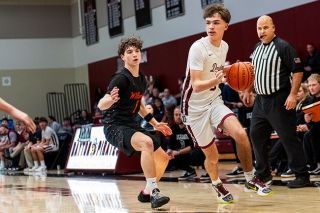 Rusty Rae/News-Register file photo##Pirate junior Taylr Miller drives toward the baseline with his left hand during Dayton&rsquo;s 58-53 victory over Willamina on Wednesday, Jan. 7, at Dayton High School. Miller led the Pirates with 20 points against Taft on Feb. 6.
