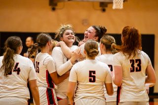 Nathan Ecker/News-Register##Freshman forward Grace Carlson, left, and senior forward Ruby Riddle, right, jump into each other s arms after their victory over Sprague on Feb. 6, in the Grizzly gymnasium. Carlson had extra reason to celebrate as it was her first time on the court this season after being sidelined by an injury. She took the floor in the fourth quarter while Mac continuously extended their lead and secured a rebound before the buzzer that prompted the entire team to rush the court like they d just won a championship.