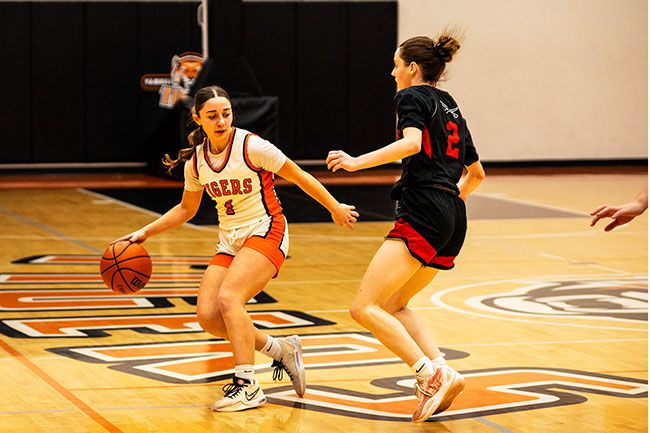 Nathan Ecker/News-Register file photo## YC&rsquo;s Ella Amerson tries to increase the space between her and Neah-Kah-Nie guard Jasmine Jones during the Tigers 44-34 win over the Pirates on Thursday, Jan. 29, at the Tiger Dome. Amerson was YC&rsquo;s leading scorer in a road victory over Warrenton on Feb. 6.