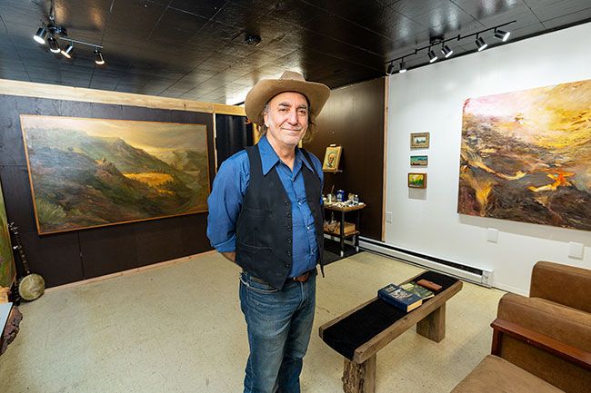Rachel Thompson/News-Register##Jody Carroll in his new art gallery in Lafayette, which features his own work. Carroll, also a musician, said he wants the gallery at 380 Third St. to be a music venue, as well.