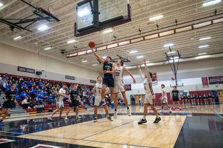 Rusty Rae/News-Register##Amity&rsquo;s Diego Dubay Lomeli drives past Dayton&rsquo;s Jax Brandon-Sanchez, extending for a finger roll layin during the Warriors&rsquo; victory over the Pirates on Feb. 10. Lomeli has had to convince himself to be more confident at the rim and showed no fear against Dayton.