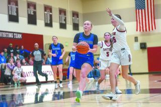 Rusty Rae/News-Register##Amity&rsquo;s Kylie Wilson drives past Dayton&rsquo;s Lexi Upmeyer for a fastbreak layup in the Warriors&rsquo; 68-35 win over Dayton on Feb. 10 in the Pirate gymnasium. Wilson has only improved with time, becoming an X factor for an already potent Warrior offense.