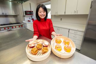 Rachel Thompson/News-Register##Joanne Tamber of McMinnville holds bamboo steamer baskets filled with Taiwanese prosperity cakes and bao in the kitchen at the McMinnville Senior Center, where she teaches cooking classes featuring recipes from her native Taiwan. Tamber will serve Taiwanese specialties at the Asian Heritage Association&rsquo;s Lunar New Year Celebration on Sunday, Feb. 15, at the McMinnville Community Center.