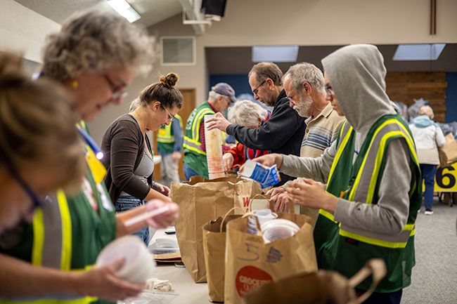 Rachel Thompson/News-Register##Volunteers and participants sort hard-to-recycle plastics. Volunteers traveled from Salem, Portland, Vancouver and the Oregon Coast to assist with the collection. Event founder Jeri White said she hopes to &ldquo;teach other communities how to fill the gap&rdquo; in recycling plastics not accepted in curbside service, and similar efforts have since begun in other communities.