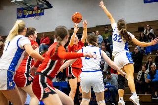 Nathan Ecker/News-Register##Alex Bates shoots over the extended hand of Newberg&rsquo;s Kuenzi Blubaugh. Bates made a trio of 3-pointers in the Grizzlies&rsquo; win over Newberg in McGrath Gymnasium on Friday, Sept. 13, but took a few attempts to adjust to Newberg&rsquo;s unique sightlines.