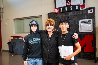 Rusty Rae/News-Register##Riley Martin, left, and Jesus Espinoza Flores pose with their personal finance teacher, Francesca Morrison, after being named the top two investors in the stock market segment of the class. Riley invested in copper mining and Jesus in technology, both making a huge &ndash; albeit pretend &mdash; profit. They also were rewarded with prizes from First Federal.