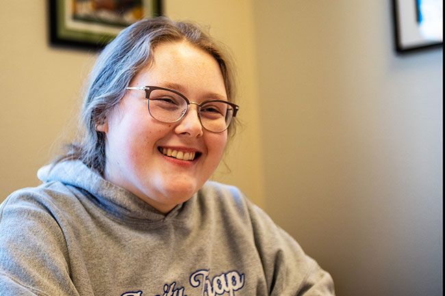 Rusty Rae/News-Register##Amity High School graduate Jamie Shevchenko, currently a Linfield University sophomore, spent fall semester in England thanks, in part, to the McMinnville Soroptimist organization. Club members stepped in after the international business major&rsquo;s car was ransacked and her laptop and other necessities stolen. Shevchenko said she loved her time at Liverpool University and had a chance to travel to Scotland and Italy, as well.