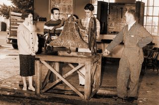 ##(Feb. 17, 1961) Examining new victory bell at Dayton High School are (left to right) Judy Francis, student body president; Harold Myers, Jan McManimie and John Leffel, school agriculture instructor. The old bell reportedly was brought around Cape Horn in 1888. It was obtained from the old grade school in Dayton that is now the American Legion hall.