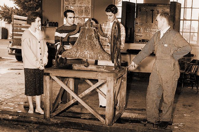 ##(Feb. 17, 1961) Examining new victory bell at Dayton High School are (left to right) Judy Francis, student body president; Harold Myers, Jan McManimie and John Leffel, school agriculture instructor. The old bell reportedly was brought around Cape Horn in 1888. It was obtained from the old grade school in Dayton that is now the American Legion hall.