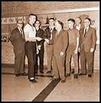 ##(Feb. 17, 1961) Mac-O-Rama coupon book-sales get underway by McMinnville High School students as Chuck Colvin, chairman of the McMinnville Chamber of Commerce Retail Merchants committee, hands first book to Kevin McGillivray, student body president. Scheduled is individual and class competition among students for sales of the &ldquo;bargain books,&rdquo; which offer hundreds of dollars in bargains in McMinnville stores during the Mac-O-Rama promotions event, due March 16-17-18. Others (left to right) are Rex Haynie, budget committee chairman; Doug Koch, sophomore class president; Gary Eborall, junior class president; Mike Keller, senior class president; A. T. &ldquo;Pete&rdquo; Beall, chamber manager; and Bill Rutherford, co-chairman of the event. Competition among the students and classes will continue for three weeks.