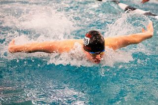 Nathan Ecker/News-Register##Olin Hamilton pushes through currents with a butterfly stroke during the 200-yard medley relay. The senior was also part of the Grizzlies record setting 400-yard freestyle squad.