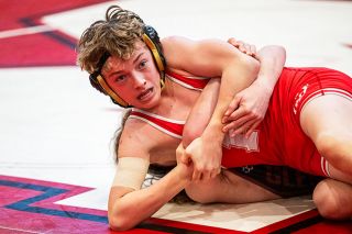 Rusty Rae/News-Register##Bryson Rex attempts to get out of a tough spot in his match against Glencoe&rsquo;s James Culbertson on Saturday, Feb. 21, during Pacific Conference District&rsquo;s.