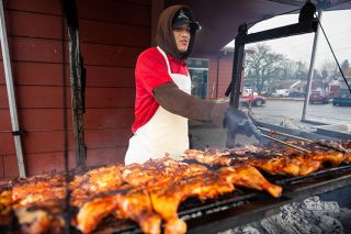 Rachel Thompson/News-Register##Carlos Ruiz Servin, an employee at Carniceria Abastos, grills chicken outside the store on Third Street in Lafayette. The store&rsquo;s weekend outdoor cooking became part of a Feb. 12 city council discussion over a proposed food cart ordinance.