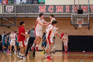 Rusty Rae/News-Register## An overjoyed group of Grizzlies (Thomas Merlier, Dylan Ferrua and Kaeden Chapman) jump for joy after completing a 76-71 double overtime victory over Century on Tuesday, Feb. 24, inside the McMinnville gymnasium. Merlier had his best game of the season, scoring 29 points with indefensible strength around the paint.