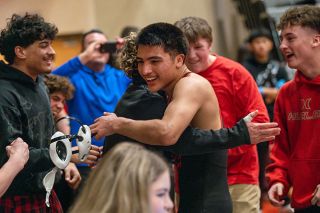 Rusty Rae/News-Register##Nelson Campos embraces his teammate, Trent Rauch, after defeating Newberg&rsquo;s Lucas Vaughn in the Pacific Conference district quarterfinals for his 100th high school career victory. Campos was giddy, but focused up to earn win No. 101 in the semifinals.