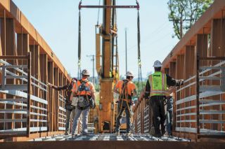 Rachel Thompson/News-Register file photo##The Dayton footbridge under construction in 2024. A leak in a water line that was part of the bridge project &mdash; completed last year &mdash; was identified and repaired by city crews over Presidents&rsquo; Day weekend. The bridge is still under warranty, likely meaning the incident won&rsquo;t cost the city.