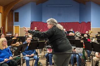 Rusty Rae/News-Register##Guest conductor Joan Paddock rehearses Second Winds Community Band members in pieces of music written by women composers. She will lead the band&rsquo;s concert &ldquo;Women of the Podium&rdquo; &mdash; named for one of the selections, &ldquo;Women of the Podium March&rdquo; by Virginia Allen &mdash; at 3 p.m. Sunday, March 8, in the McMinnville Community Center.
