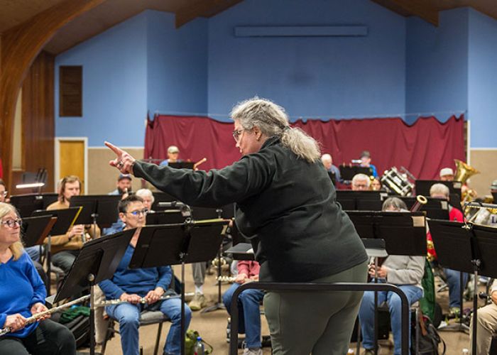Rusty Rae/News-Register##Guest conductor Joan Paddock rehearses Second Winds Community Band members in pieces of music written by women composers. She will lead the band&rsquo;s concert &ldquo;Women of the Podium&rdquo; &mdash; named for one of the selections, &ldquo;Women of the Podium March&rdquo; by Virginia Allen &mdash; at 3 p.m. Sunday, March 8, in the McMinnville Community Center.
