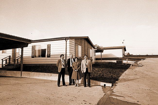 ##(March 2, 1981) Larry Stacey, Sunset Properties; Clayton Park owners John and Lois Otting; and Dennis Moore, marketing rep. for Silvercrest manufactured homes, stand in front of one of the new units placed in the park, which is nearing completion. Park is located on Riverside Drive just off Lafayette Avenue.