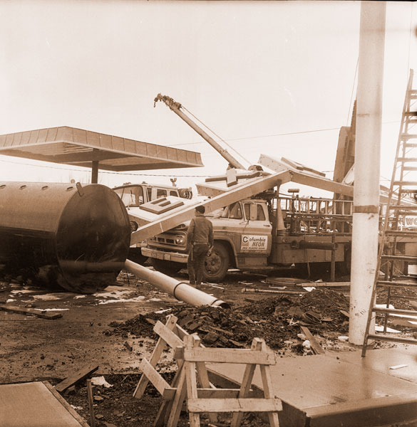 ##(March 3, 1971) Luckily, no one was hurt when a heavy sign at the new Texaco station, McDonald Lane and Highway 99W, fell over onto a truck Tuesday about 1:15 p.m. The sign, valued at about $7,000, was heavily damaged. Luminite Signs of Portland was installing the sign when a brake on a boom gave way, narrowly missing a workman.