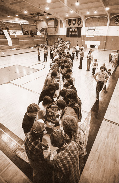 ##(March 4, 1981) Dozens and scores of McMinnville High School students rapidly prepare the record-breaking banana split in the high school gym Tuesday night just before they devoured the prize confection. They created 159 splits in the Young Life sponsored affair.