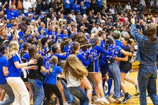 Nathan Ecker/News-Register##Amity&rsquo;s student section pours on to Hoffine Court, meeting Lyliana Rideout and the entire band of two-time champion Warriors in a celebration that carried well past the time they left the Marshfield High School gymnasium.