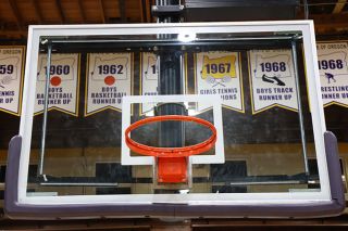 Nathan Ecker/News-Register##A hoop at Marshfield High stands devoid of a net, having been stripped clean by Amity&rsquo;s championship celebration, patiently awaiting and watching for the next title contender. It&rsquo;s mouth agape left me wondering how many moments it&rsquo;s seen.