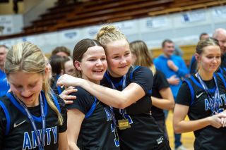Rusty Rae/News-Register##Amity seniors Alyssa McMullen (left) and Kylie Wilson (right) share smiles while celebrating their 47-44 championship victory over Vale at Marshfield High School on Saturday, March 7. The win marked two consecutive basketball titles and the group&rsquo;s third in 13 months along with a soccer championship in the fall of 2025.
