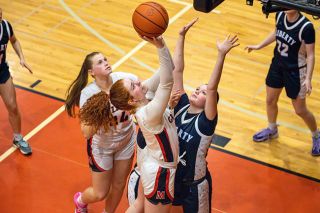 Nathan Ecker/News-Register##Mac senior Brooklynn Summers rises over a defender from Liberty during the Grizzlies 77-24 senior night victory. In her final game as a Grizzly, Summers put up 17 points and came down with 11 rebounds. At no point did they think that they would lose to Sheldon.