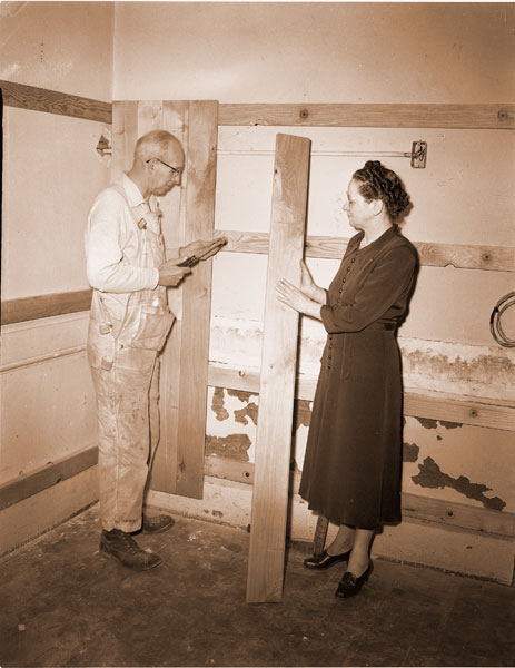##(March 8, 1956) Mrs. Miriam Jernstedt, city librarian, admires alder paneling which will be used in the new children’s library as Glen Trussell hammers a panel in place. The natural finish alder also will be used for bookcases and woodwork. ##(March 8, 1956) Mrs. Miriam Jernstedt, city librarian, admires alder paneling which will be used in the new children’s library as Glen Trussell hammers a panel in place. The natural finish alder also will be used for bookcases and woodwork.
