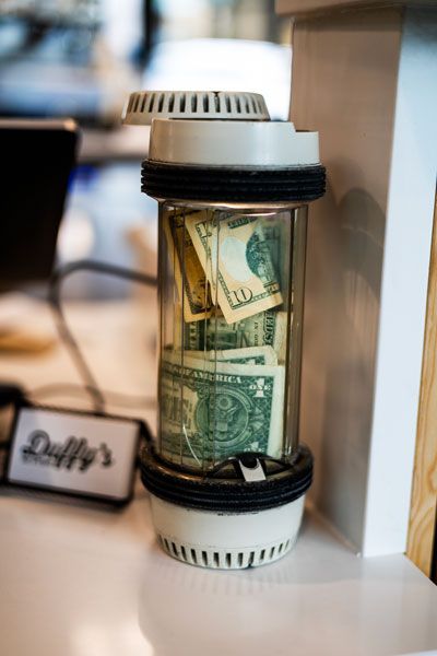 Rachel Thompson/News-Register##Duffy&rsquo;s has a drive-up window so customers can get their food and beverages, rather than a pneumatic tube system that was used when the building was a bank. But one of the tubes remains on the counter as a tip jar.
