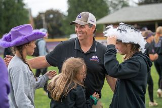 Rusty Rae/News-Register file photo##Jackson Vaughan embraces his daughters Hallie, Reese and Finley after the Wildcats Super Regional victory over the Central College Dutch on May 24, 2024, to advance to the NCAA DIII Championship tournament. When they&rsquo;re not busy with their own sports, Vaughan&rsquo;s kids are by his side with their mother, Shelly, as his loudest supporters.