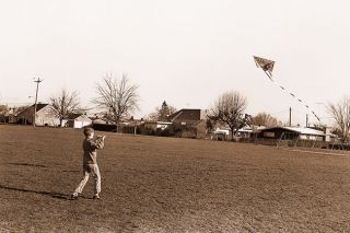 ##(March 20, 1971) Spring will &ldquo;spring&rdquo; officially Sunday, but the weather this week indicated the date is wrong. Kites were out in force, including this one flown by Tim Elliott at Memorial School.