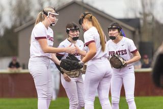 Nathan Ecker/News-Register##From left to right: Gabby Chupp, Bella Lopez, Charly Upmeyer and Lou Auvil share ritual pre-inning high fives during Dayton&rsquo;s 5-2 victory over 4A Cascade on Friday, March 20, at Jim Connelly Field. Along with Rachel Baumholtz at first base, the Pirates infield was lock down behind Upmeyer in the win.