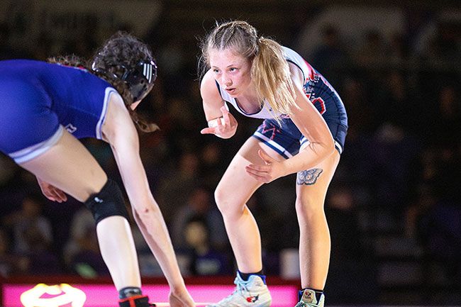 Rachel Thompson/News-Register file photo##Zoe Brewer faces Linfield&rsquo;s Jessica Cottings at 105 pounds during a duel meet between SWOCC and the Wildcats at Ted Wilson Gymnasium on Jan. 30.