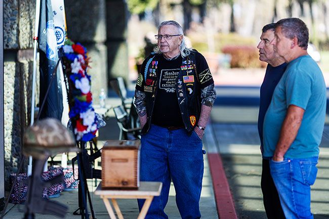 Rachel Thompson/News-Register##Brothers Jon and Jim Briggs of McMinnville stand with Vietnam veteran Terry Weakley as they as they visit the wall. &ldquo;You just want to go and read names and say them out loud, and show some respect for the people that served and gave all,&rdquo; said Jon, a Marine Corps veteran.