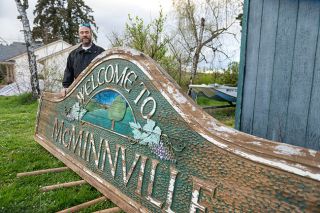 Rusty Rae/News-Register##Jerome Blankenship stands next to the sign he will refurbish to be installed at the southern entrance of the city. The sign has been sitting near his Carlton workshop since it was removed from its former home on Highway 99W.
