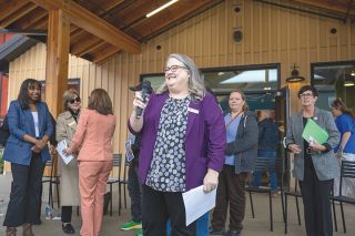 Rachel Thompson/News-Register##Vickie Ybarguen, director of the Housing Authority of Yamhill County, welcomes public officials and other supporters to the opening of Stratus Village. It will go a long way toward meeting housing needs in the county, she said, but there still is a lengthy waiting list. More projects are in planning stages.