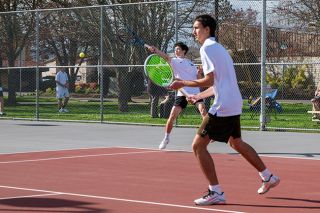 Rusty Rae/News-Register##Ewtai Bills (background) tries to smash a shot to his opponents while Brady Haught (foreground) gets set near the center line. The duo is Mac&rsquo;s new No. 1 doubles team in 2026 and looks to replicate the success seen by their predecessors.