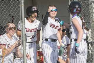 Nathan Ecker/News-Register##Dayton&rsquo;s Rachel Baumholtz (left) and Bella Lopez (center) welcome Hayden Bell into the dugout with fist bumps and congratulatory cheers after scoring the Pirates&rsquo; third run of the game in their victory over Yamhill Carlton on Monday, April 6, at Jim Connelly Field.