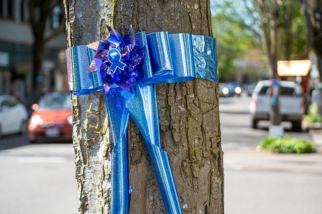 Ossie Bladine/News-Register##Ribbons tied to downtown McMinnville trees signify Child Abuse Prevention Month, with blue being the designated color for this cause.