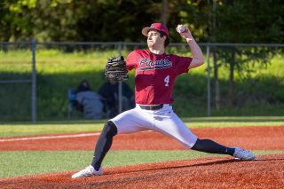 Nathan Ecker/News-Register##Carter Webster stretches out, preparing to hurl a fastball to the plate. Webster struck out seven despite not having a feel for his off-speed pitches, instead relying on heaters to blow Amity away.