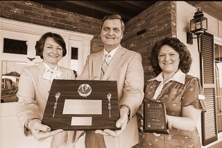## (April 17, 1981) McMinnville Chapter of Credit Women-International named Dr. Paul Jahnke &ldquo;Boss of the Year&rdquo; Thursday. He is flanked by June Hilton and his employee, Mary Lou Henderson, who nominated the ophthalmologist for the award.