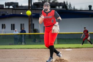Nathan Ecker/News-Register file photo##Rylan Carton guides a pitch to the strike zone in a home start versus Lake Oswego on Wednesday, April 10. Against Century on April 17, Carton returned to the circle and threw a gem on the road, allowing just four hits and punching out as many.