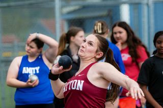Rusty Rae/News-Register##Dayton junior Hadley Hughes powers up to hurl four-kilogram shot put. She won the event with a toss of 35-6 3/4. Hughes also won the discus by 20 feet and the javelin by 36 feet over the second-place mark of 92-11.