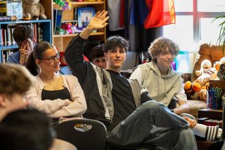 Rachel Thompson/News-Register##Julius Vetter, a 16-year-old from Neuenburg am Rhein, Germany, raises his hand to speak during a discussion in a McMinnville High School German language class. Vetter and his classmates, including Felicia Ortlieb, on his right, are visiting Mac High this month; local students will travel to Neuenburg in June.