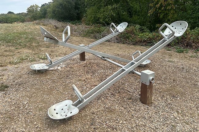 Kirby Neumann-Rea/News-Register##Huddleston Pond offers a large teeter-totter, a feature found less and less often, let alone this size.