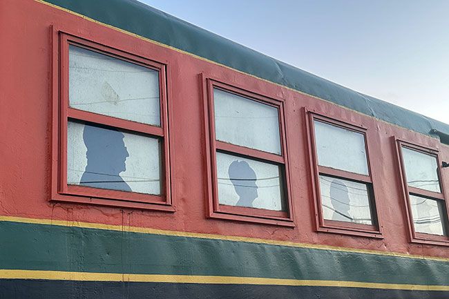 Kirby Neumann-Rea/News-Register##Civic leaders who helped bring the Galloping Goose back to town are honored with window silhouettes.