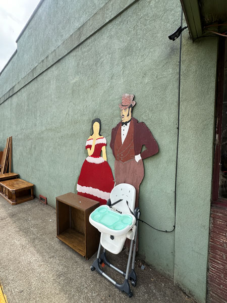 Kirby Neumann-Rea/News-Register##Antique figures stand silently, and with little or no expression, outside Willamina Thrift Store.